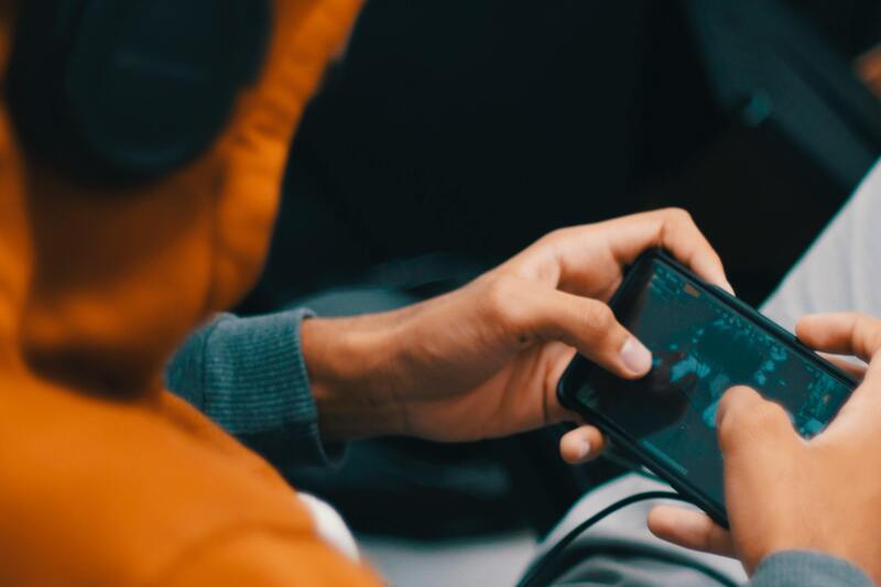 Boy playing a game on a phone