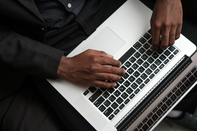 Person typing on a laptop