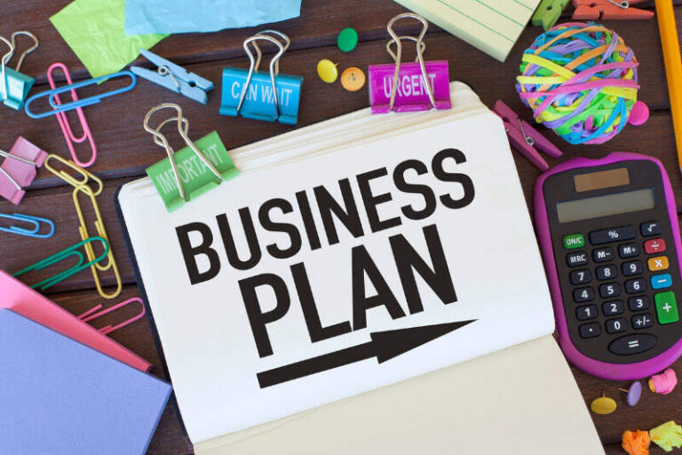 Paper with words 'Business Plan' printed on it