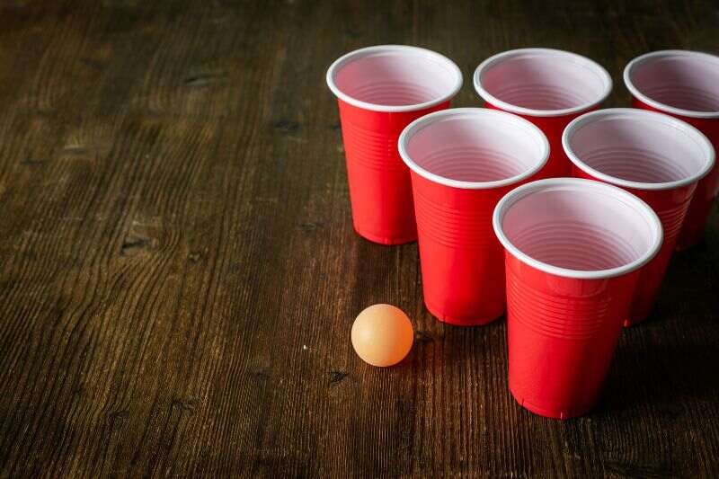 Red dixxie cups and a ping pong ball
