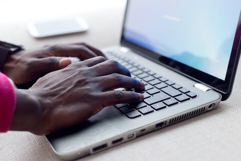 Man typing on laptop