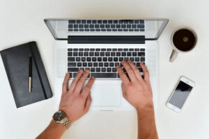 Person typing on laptop