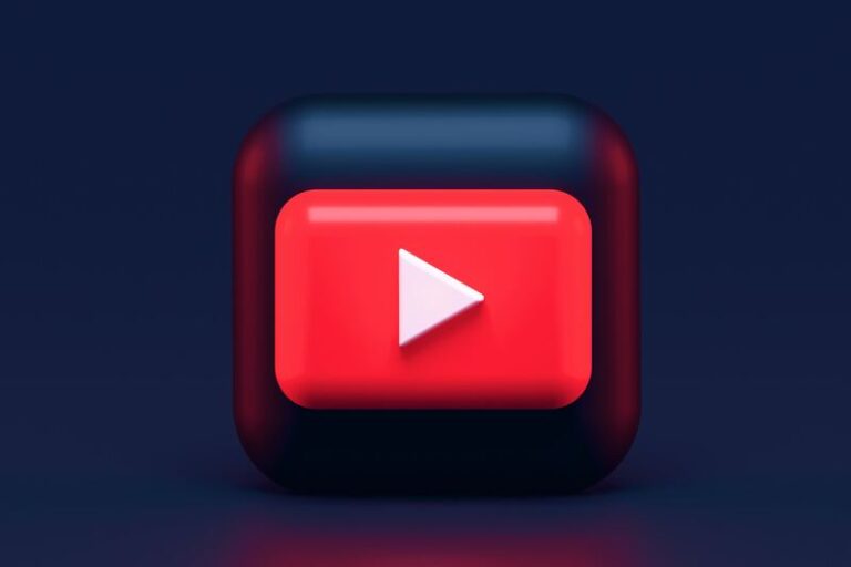 Red YouTube logo with dark background