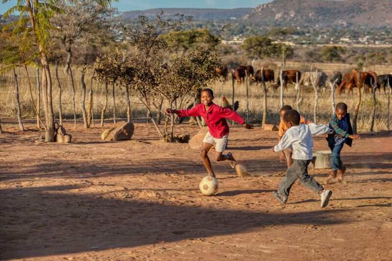 African boys playing football