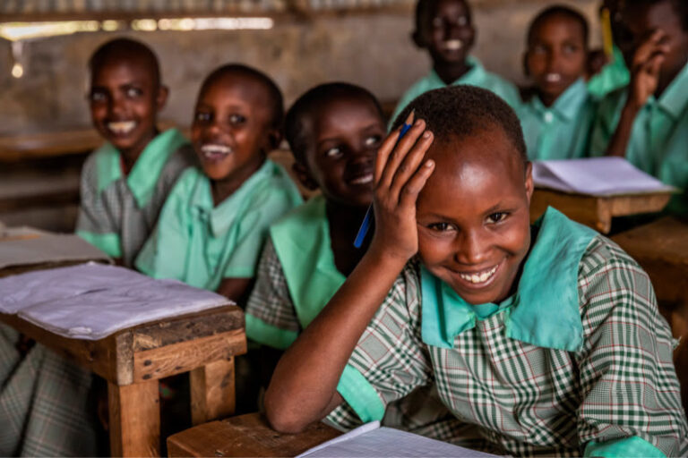 Happy primary school children in a classroom