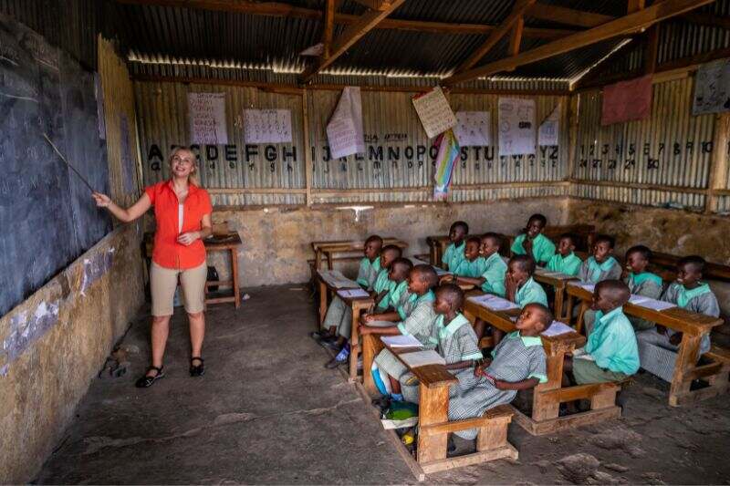 Teacher teaching pupils in a class