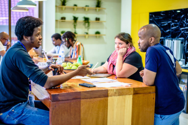 People discussing on a desk